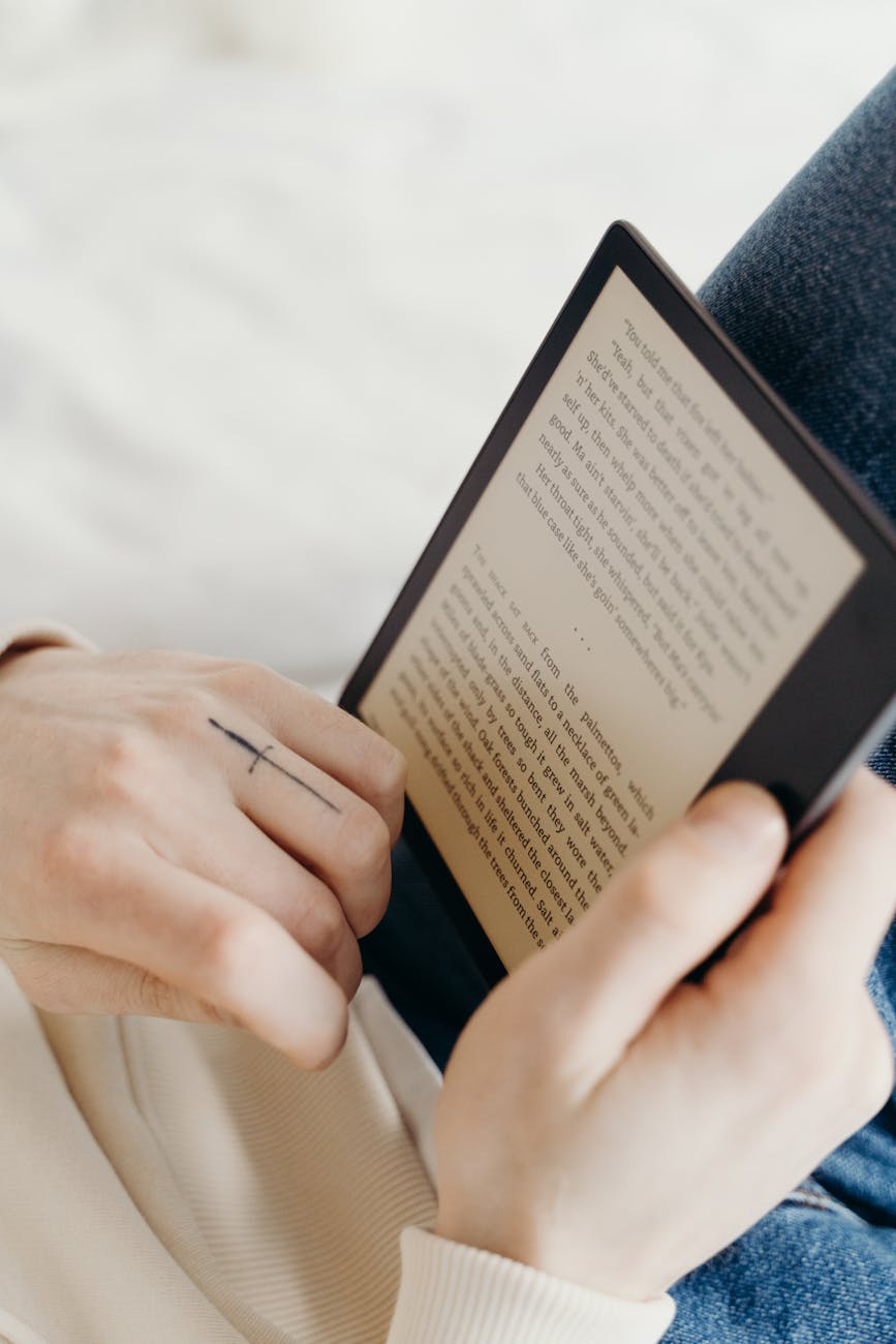 close up shot of a person reading an electronic book